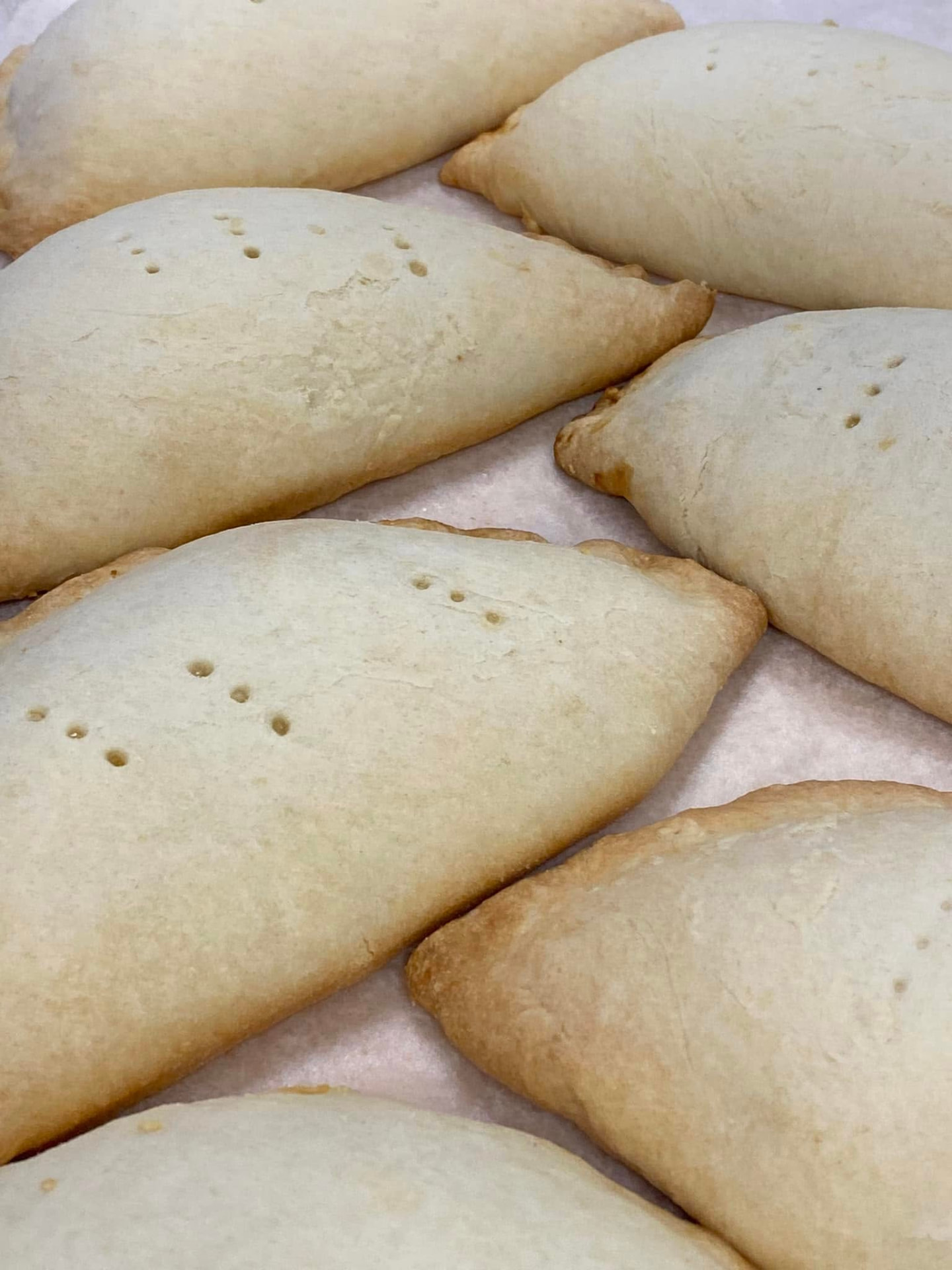 Golden hand pies on parchment