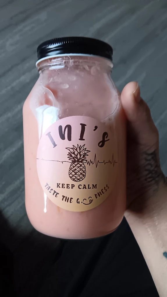 Pink smoothie in an Ini's glass jar